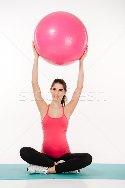 Stock photo: Beautiful pregnant woman doing exercises with fitball