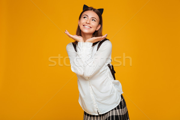 Portrait of a lovely smiling schoolgirl with backpack Stock photo © deandrobot