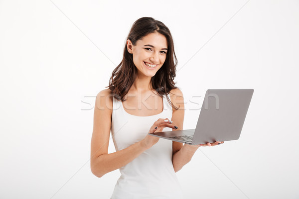 Portrait of a smiling girl dressed in tank-top Stock photo © deandrobot