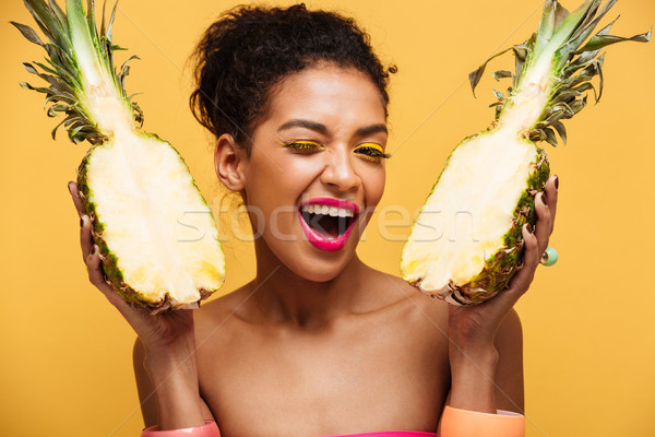 Portrait of happy mixed-race woman with fashion appearance holdi Stock photo © deandrobot