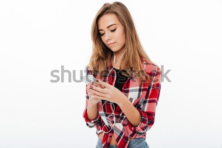 Portrait of a lovely pretty girl in plaid shirt Stock photo © deandrobot