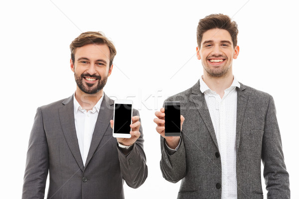 Portrait of a two happy business men Stock photo © deandrobot