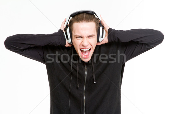 Homme écouter musique casque hurlant portrait [[stock_photo]] © deandrobot