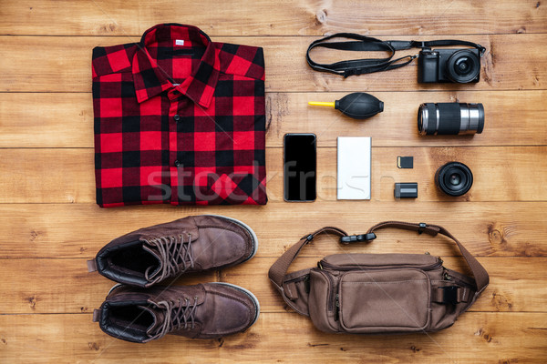 Travel concept boots, shirt, camera, mobilephone, bag, mp3, Stock photo © deandrobot