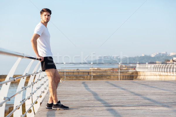 Nachdenklich jungen Sportler stehen Freien Denken Stock foto © deandrobot