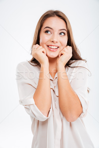 Portrait of a casual happy wondering woman thhinking about something Stock photo © deandrobot