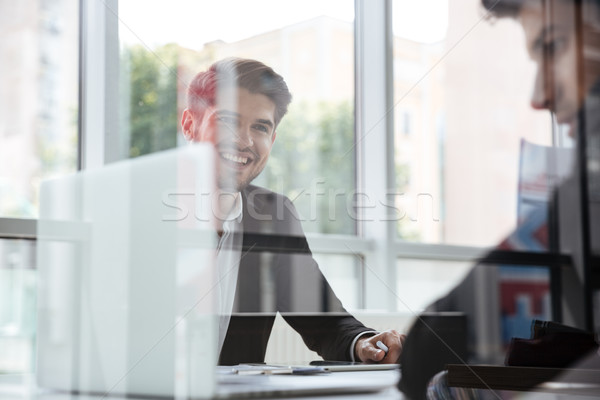 Dois alegre jovem empresários laptop reunião de negócios Foto stock © deandrobot