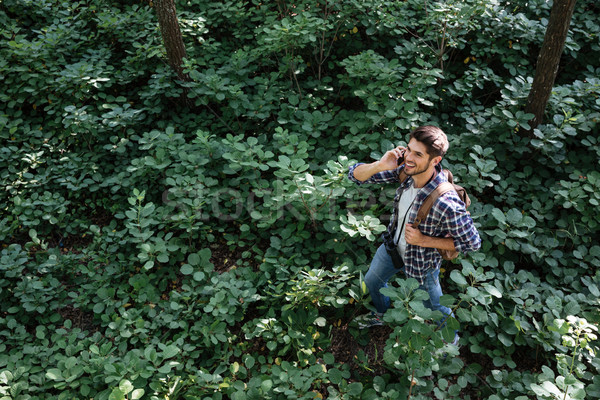 Side view of guy in forest Stock photo © deandrobot