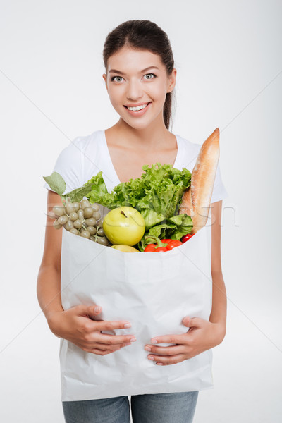 Model holding package with food Stock photo © deandrobot