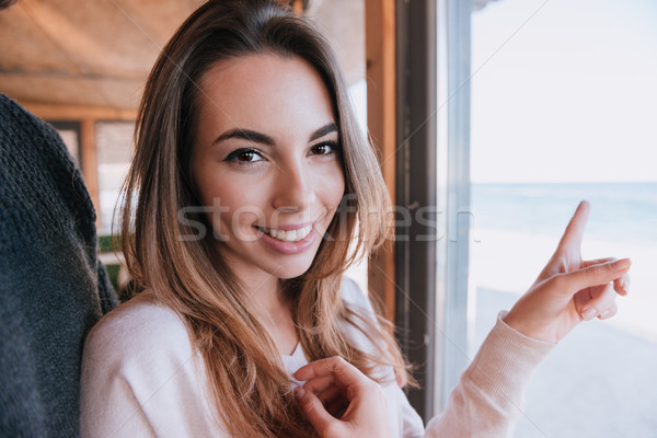 улыбающаяся женщина дата окна кафе человека глядя Сток-фото © deandrobot
