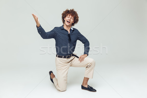 Emotional young retro man dressed in shirt Stock photo © deandrobot