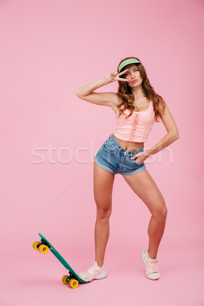 Full length portrait of a young woman in summer clothes Stock photo © deandrobot