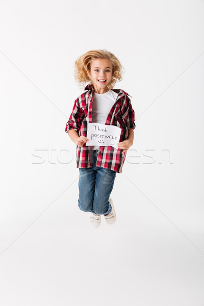 Full length portrait of a cheerful little girl Stock photo © deandrobot