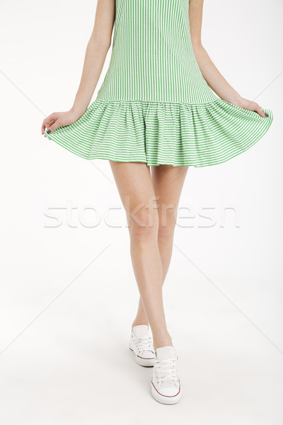 Half body portrait of a young girl in dress walking Stock photo © deandrobot