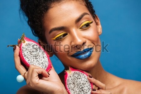 Horizontal image of fancy mulatto woman with colorful makeup and Stock photo © deandrobot