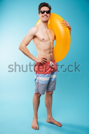 Stock photo: Full length portrait of a shocked young shirtless man