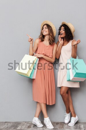 Stock photo: Full length portrait of two happy young women