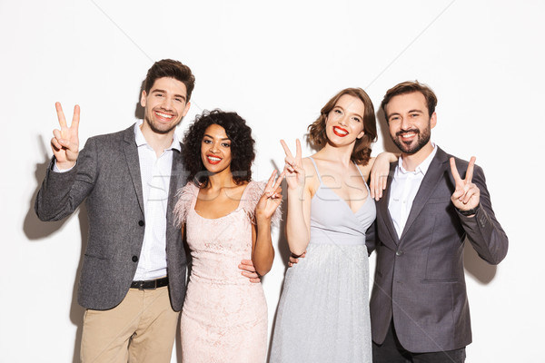 Group of happy well dressed multiracial people Stock photo © deandrobot