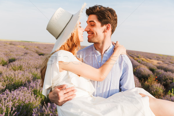 Lovely young couple having fun at the lavender field Stock photo © deandrobot