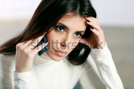 Fiatal figyelmes nő beszél telefon lány Stock fotó © deandrobot