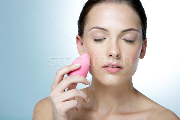 Stock photo: Attractive woman cleaning his face with closed eyes