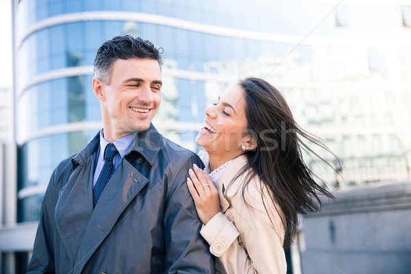 Laughing couple flirting outdoors  Stock photo © deandrobot