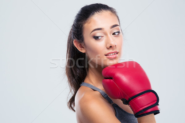 Portrait of a cute fitness woman with boxing gloves  Stock photo © deandrobot
