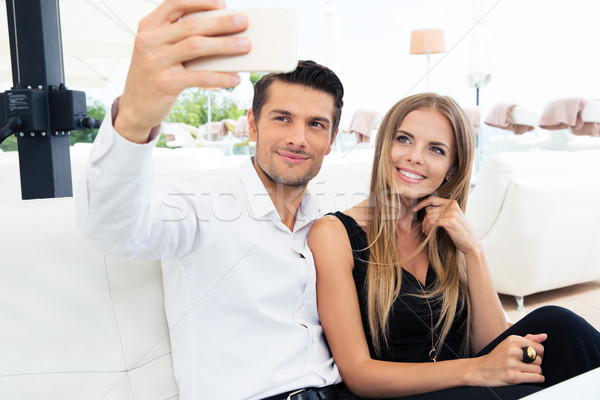 Stock photo: Couple making selfie photo in restaurant