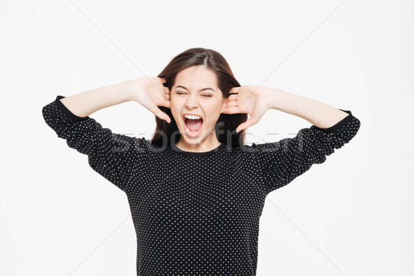 Beautiful woman screaming Stock photo © deandrobot