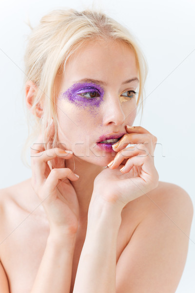 Beauty portrait of woman with stylish makeup touching her lips Stock photo © deandrobot