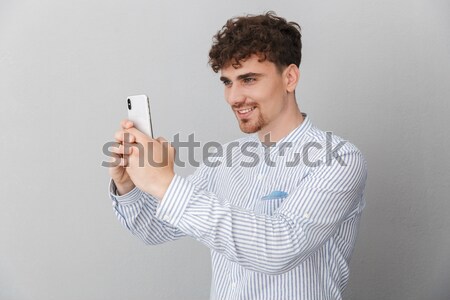 Portret jonge man naar condoom witte teken Stockfoto © deandrobot