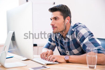 Concentrated man at home analyzing finances and look aside Stock photo © deandrobot