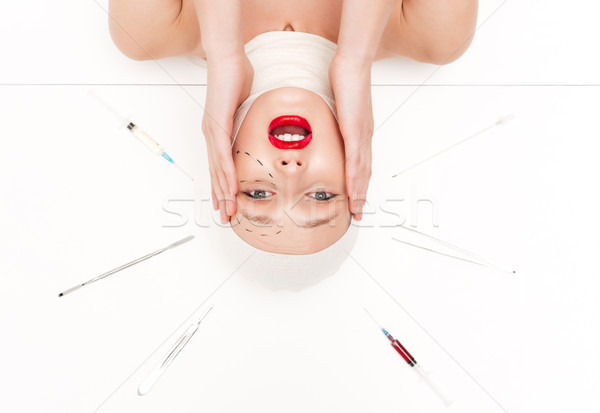 Nieszczęśliwy kobieta powyżej chirurgiczny głowie obcasy Zdjęcia stock © deandrobot