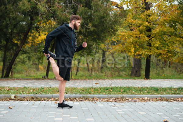 Full length runner warming up Stock photo © deandrobot