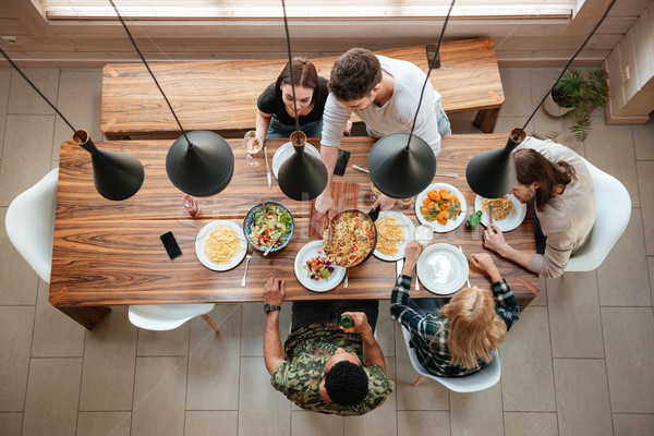 Top view persone cena insieme seduta Foto d'archivio © deandrobot
