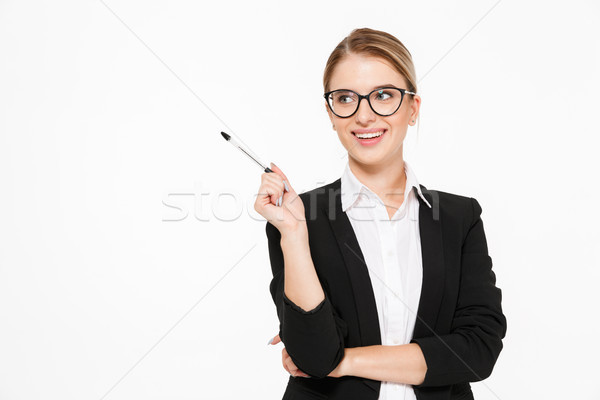Happy blonde business woman in eyeglasses with pen in hand Stock photo © deandrobot