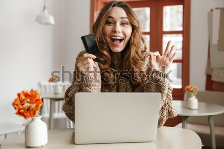 Photo of strict woman in sweater looking on camera and gesturing Stock photo © deandrobot