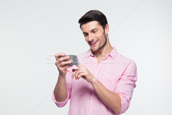 Stock photo: Happy businessman using smartphone