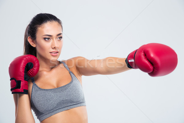 Portrait of fitness woman boxing in gloves  Stock photo © deandrobot