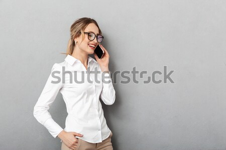 Tired teenage girl in glasses sitting and sleeping at table Stock photo © deandrobot