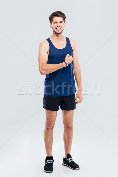 Retrato sonriendo hombre bíceps Foto stock © deandrobot