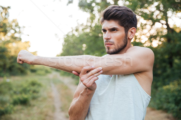 Runner warming up in forest Stock photo © deandrobot