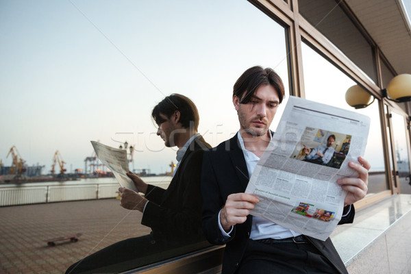 Man in suit with newspaper Stock photo © deandrobot