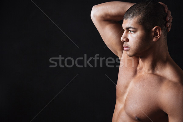 Stock photo: Serious young african sportsman posing