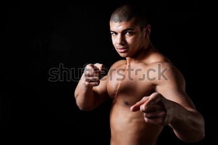 Happy young african sportsman standing with okay gesture Stock photo © deandrobot