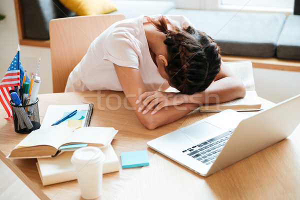 African Woman sleeping by the table with laptop Stock photo © deandrobot