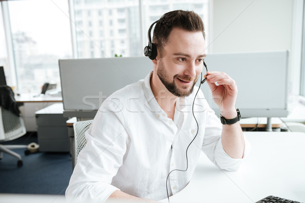 Man talking on headset Stock photo © deandrobot