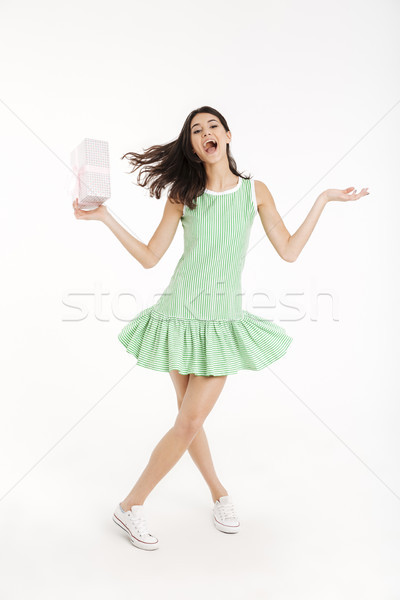 Full length portrait of an excited girl dressed in dress Stock photo © deandrobot
