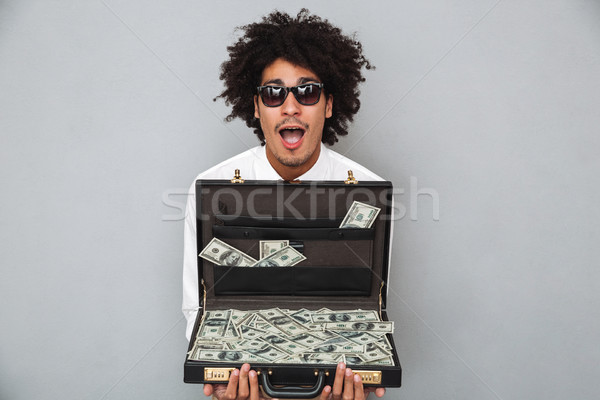 Portrait of a cheerful excited afro american man Stock photo © deandrobot