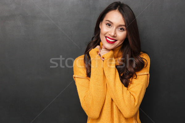 Pretty smiling brunette woman posing and looking at the camera Stock photo © deandrobot